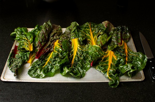 Chard on a baking sheet, ready for the oven