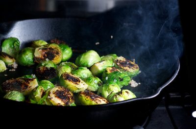Once the sprouts are charred, add shallot that has been tossed with oil